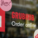 Window sign indicating Grubhub delivers from this location